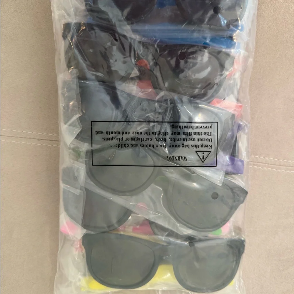 Twelve Plastic Sunglasses